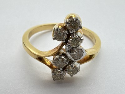 Lot 221 - A Seven Stone Diamond Ring, of abstract...