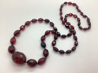 Lot 180 - A Cherry Amber Coloured Faceted Bead Necklace,...