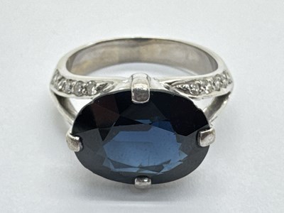 Lot 234 - A Modern Sapphire and Diamond Dress Ring, the...