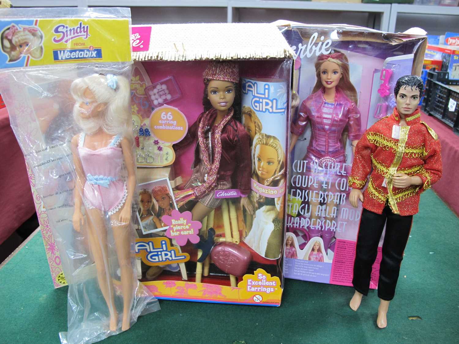 Lot 512 - Four Collectible Dolls comprising of Mattel...