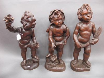 Lot 1229 - A Set of Three XIX Century Carved Wood Cupids,...