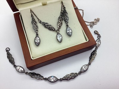 Lot 213 - A Celtic Knot Style Stone Set Panel Bracelet,...