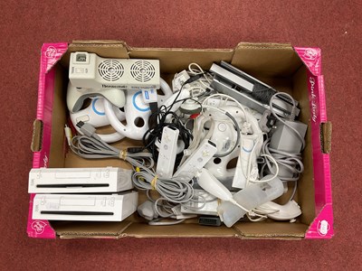 Lot 784 - Two Nintendo Wii Games Consoles. Together with...