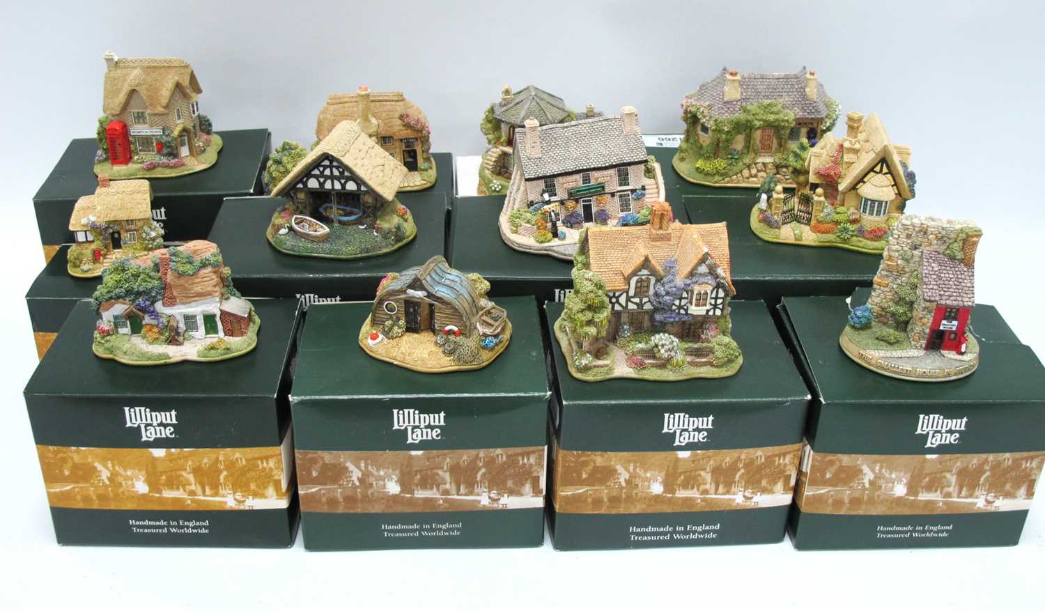 Lot 1266 - Lilliput Lane; A collection of boxed models to...