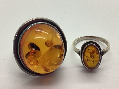 Lot 209 - A Large Amber Coloured Inset Ring, the oval...