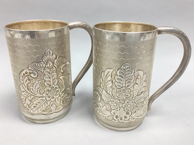 Lot 24 - A Pair of Indian Mugs, highly decorative tall...