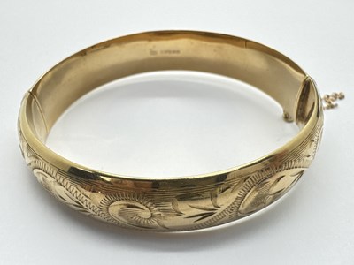 Lot 209 - A Vintage 9ct Gold Hinged Bangle, with allover...