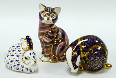 Lot 1064 - Three Royal Crown Derby Porcelain Paperweights,...