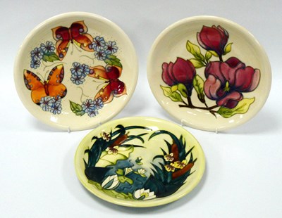 Lot 1011 - Three Moorcroft Pottery Plates, painted in the...