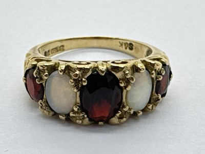 Lot 240 - A 9ct Gold Victorian Style Opal and Garnet Set...
