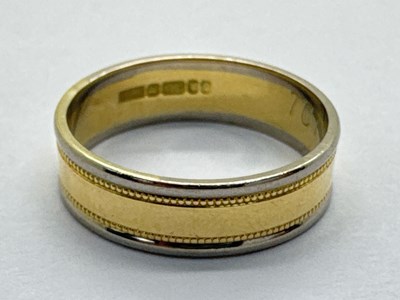 Lot 244 - A Modern 18ct Two Colour Gold Band, (numbered...