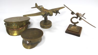 Lot 443 - WWI Trench Art Brass Peaked Cap Ash Trays, one...