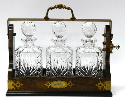 Lot 1238 - A Mid XX Century Oak Cased Tantalus, with...