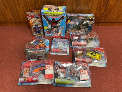 Lot 783 - Nine Transformers Toys by Hasbro, Kidz Biz to...