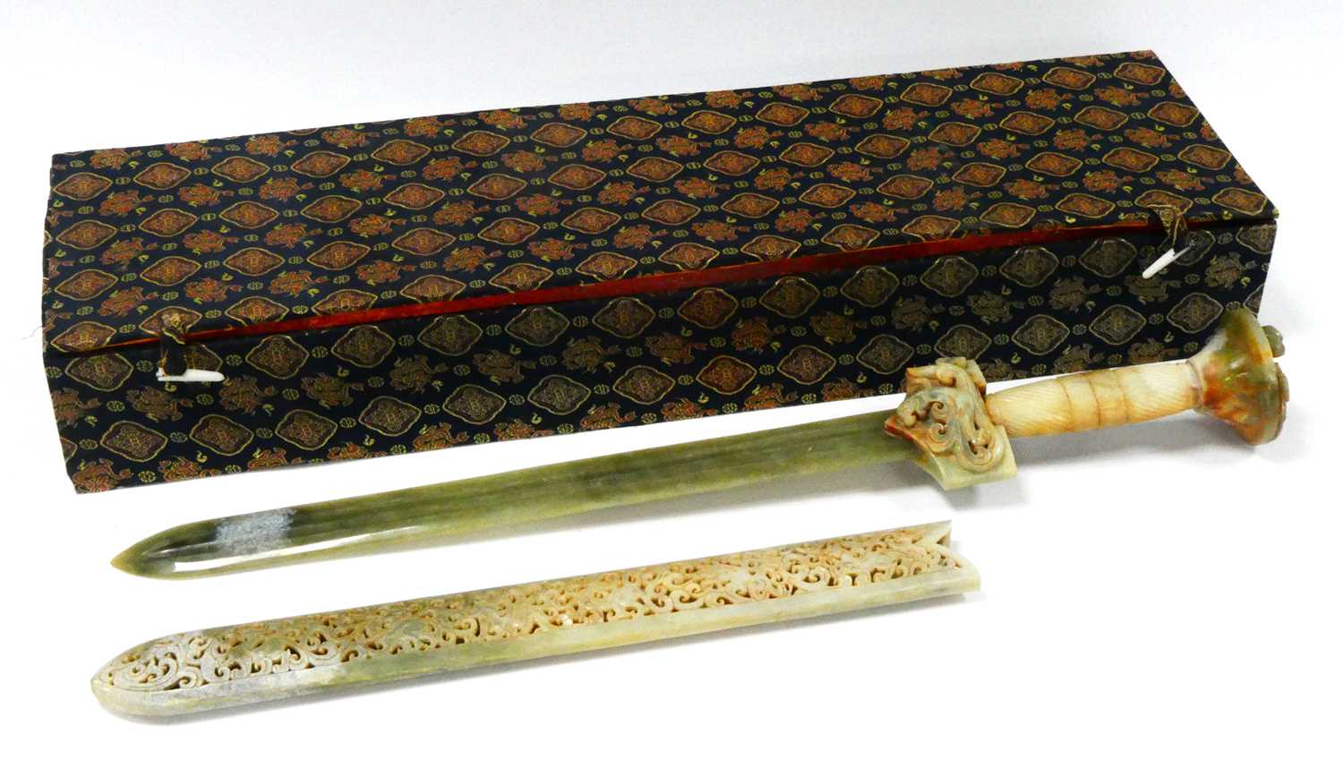 Lot 1095 - A Jadeite Sword, contained in a pierced sheath,...