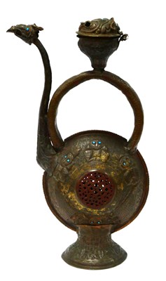 Lot 1090 - An Early Islamic Metal Ewer, with embossed...