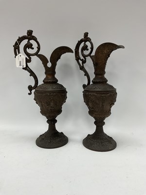 Lot 1443 - A pair of heavy cast metal ornately decorated...