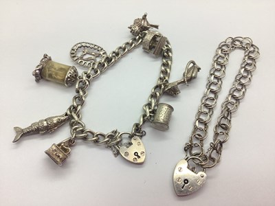 Lot 137 - A Curb Link Charm Bracelet, to heart shape...
