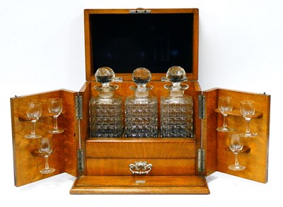 Lot 1179 - An Early XX Century Tantalus, the oak case...