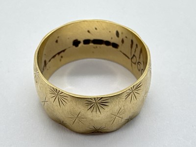 Lot 52 - A 9ct Gold Wide Textured Wedding Band, with...