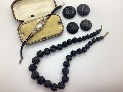 Lot 167 - A Carved Jet Coloured Beaded Necklace,...