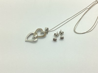 Lot 169 - A Modern 9ct White Gold Double Heart Pendant,...