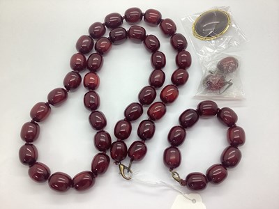 Lot 231 - A Cherry Coloured Beaded Necklace, together...