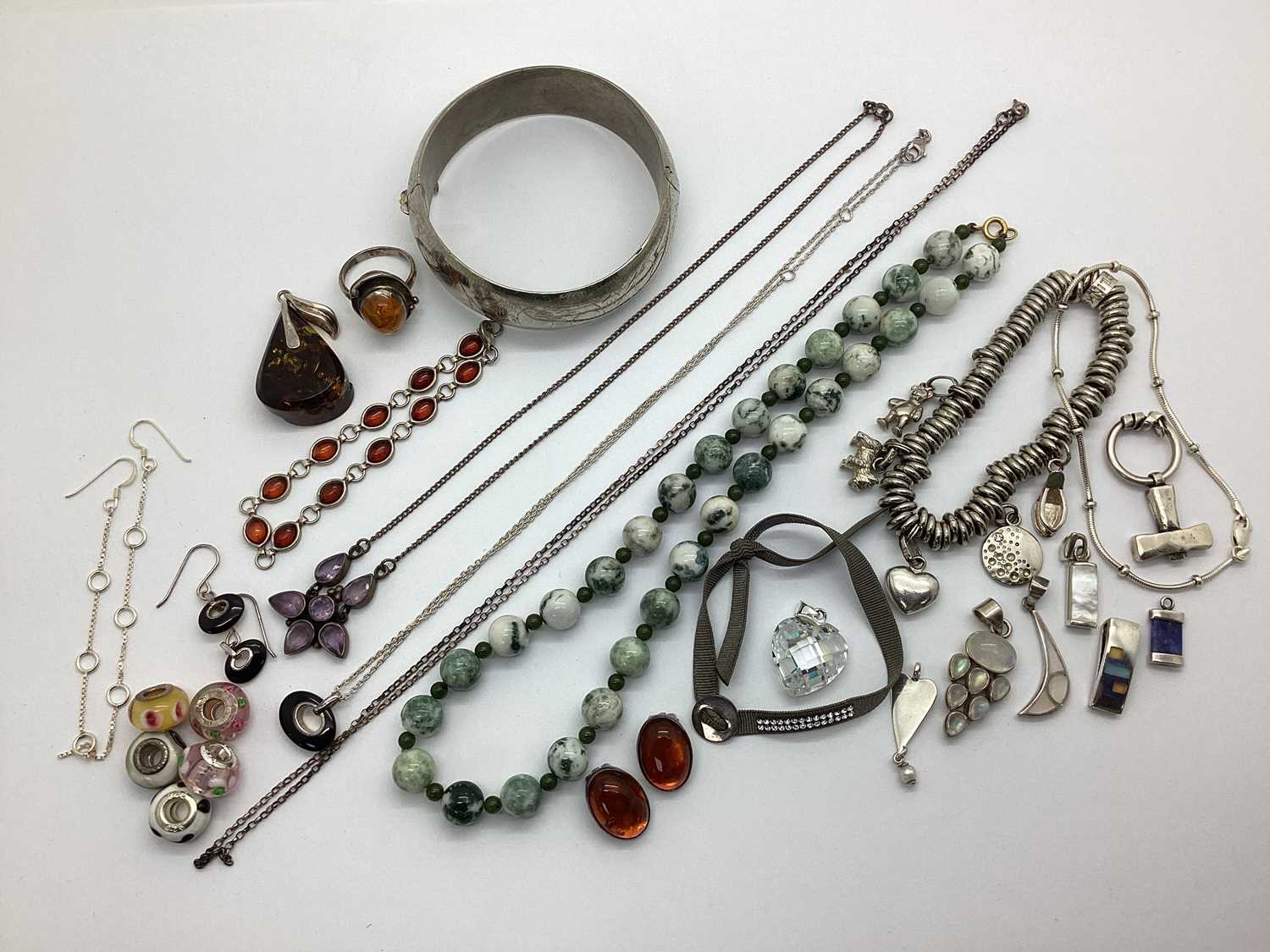Lot 119 - A Hinged Bangle, polished bead necklace,...