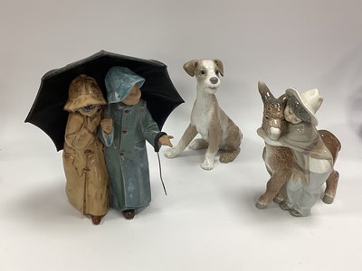 Lot 1253 - Lladro Pottery Couple Under Umbrella 24.5cm...