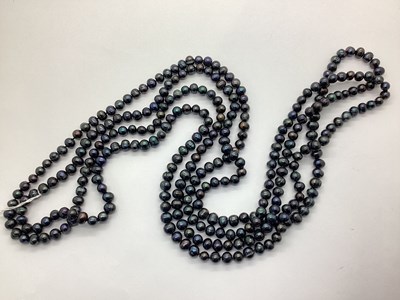 Lot 149 - A Peacock Coloured Pearl Bead Opera Length...