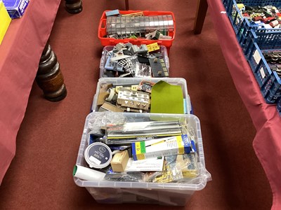 Lot 474 - Four containers with the contents of a model...