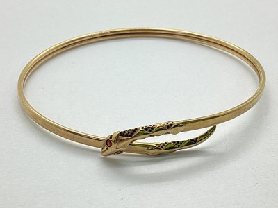 Lot 79 - A 9ct Gold Serpent Bangle, of wrap design with...