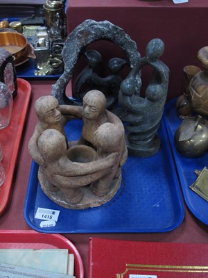 Lot 1415 - A terracotta figure of four friends in a...