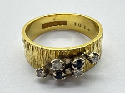 Lot 58 - An 18ct Gold Diamond and Stone Set Ring, the...