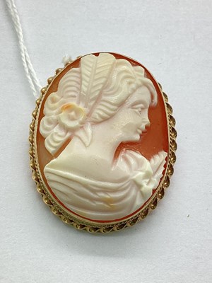 Lot 102 - A 9ct Gold Carved Cameo Brooch, the oval panel...