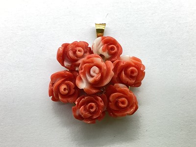 Lot 83 - A Modern Circular Coral Pendant, in the form...