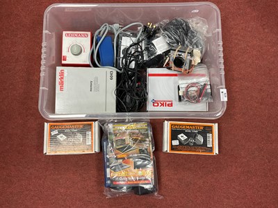 Lot 573 - A quantity of model railway control equipment...