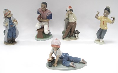 Lot 1223 - Lladro American Footballer '6135', two...