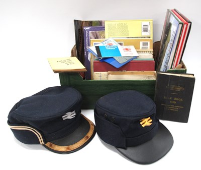 Lot 1379 - Railway - two peak caps, books, including...
