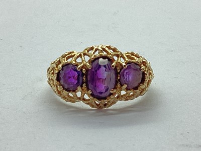 Lot 71 - A Vintage 9ct Gold Three Stone Ring, the oval...