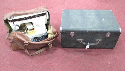 Lot 1486 - A Cased Singer Sewing Machine Model EC581839...