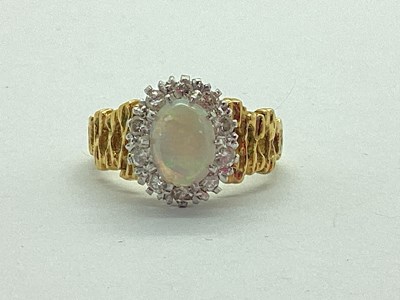 Lot 41 - An 18ct Gold Diamond and Stone Set Cluster...