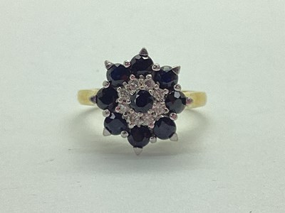 Lot 32 - An 18ct Gold Diamond and Stone Set Cluster...