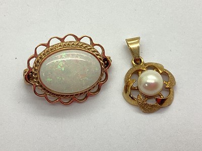 Lot 107 - A 9ct Gold Pearl Bead Inset Flowerhead Pendant,...