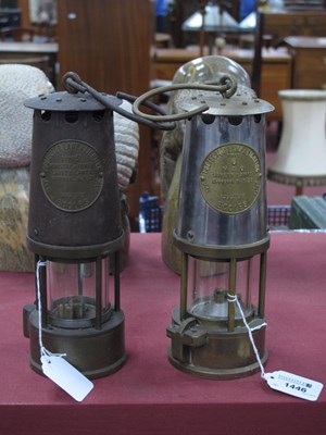 Lot 1446 - Two miners safety lamps by Protector lamp &...