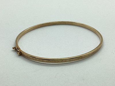 Lot 95 - A 9ct Gold Dainty Bangle, with textured...