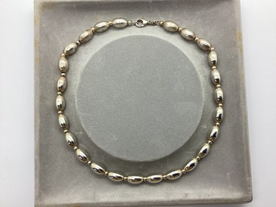 Lot 165 - A Hallmarked Silver Beaded Necklace, 42cm long.