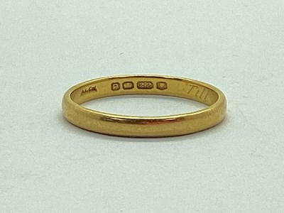 Lot 55 - A 22ct Gold Slim Plain Wedding Band, engraved "...