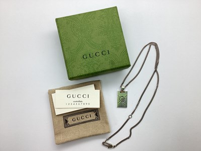 Lot 153 - Gucci; Ghost Tag Pendant, stamped "Gucci",...