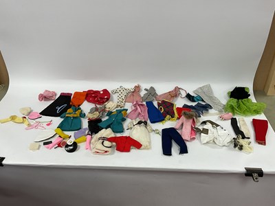 Lot 861 - A Quantity of circa 1970s dolls clothing and...